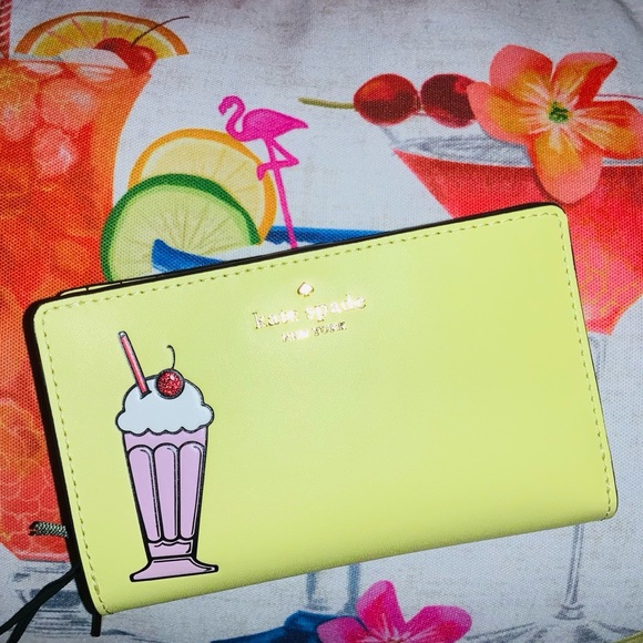 kate spade Handbags - Kate Spade Yellow leather wallet